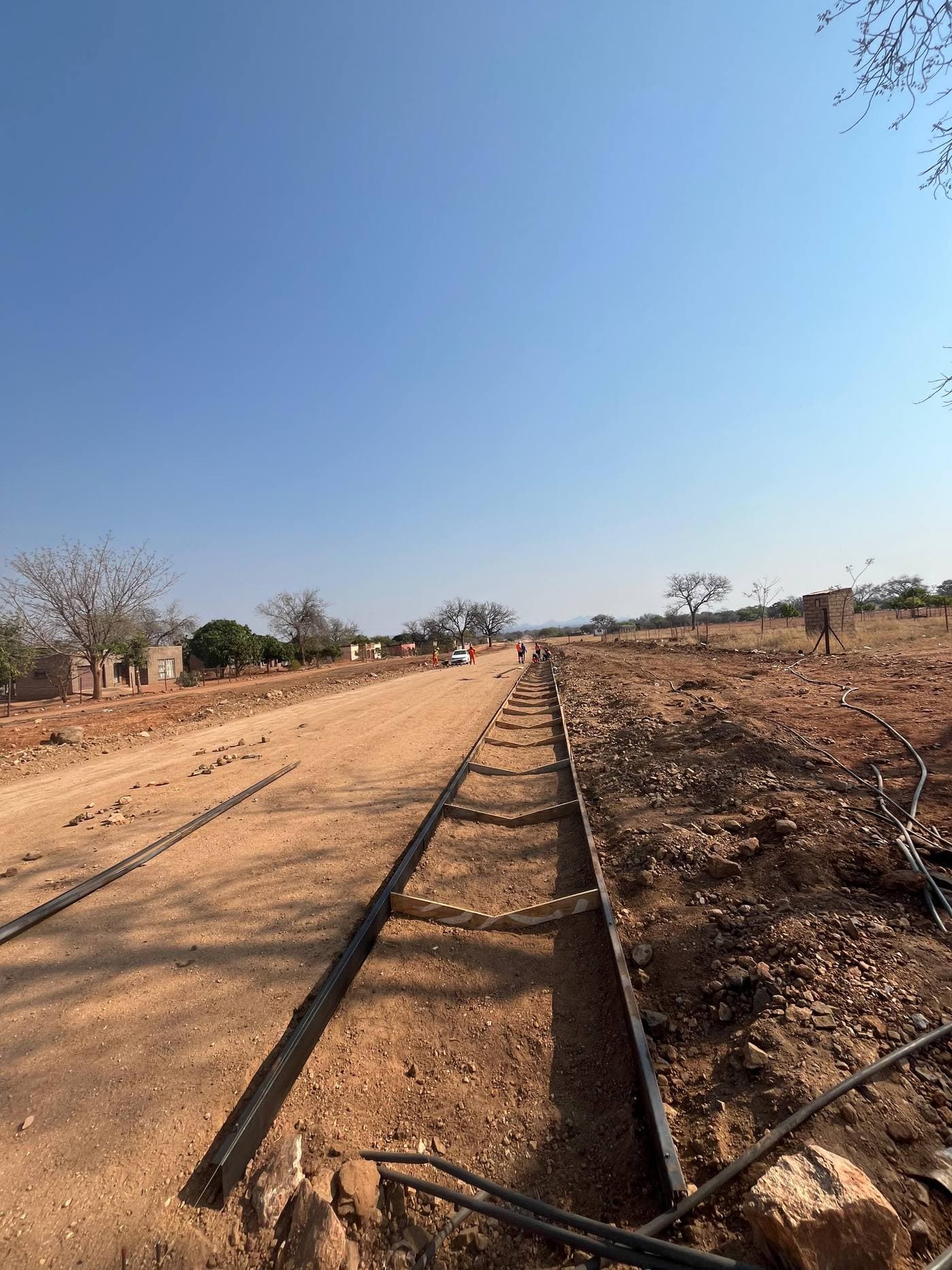 Worker measuring a project site