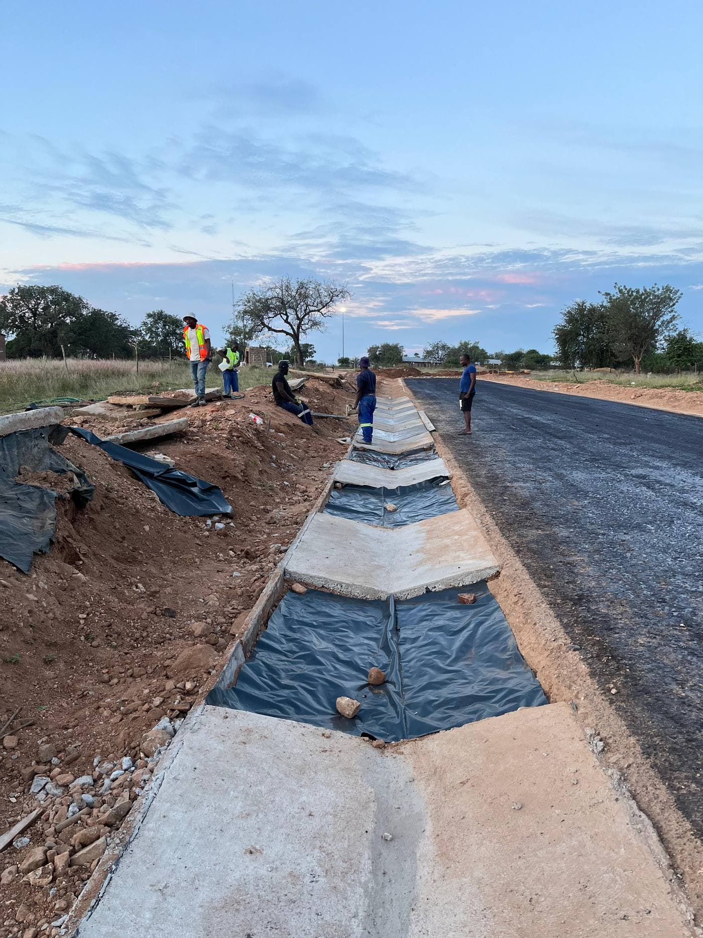 Civil works crew completing a channel section